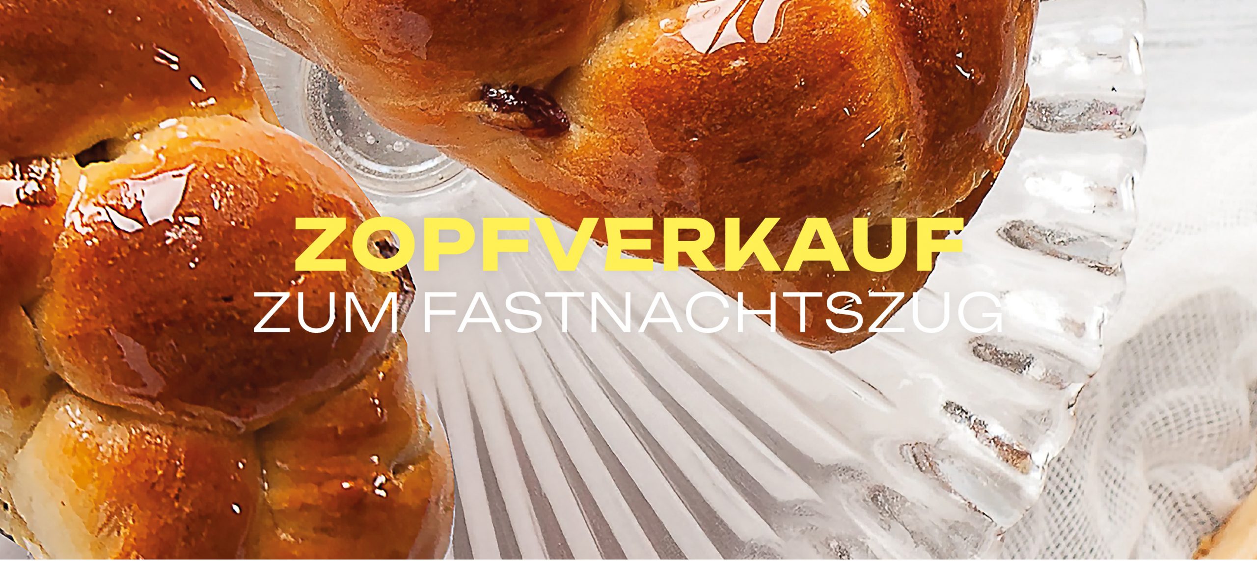 Detailaufnahme eines frisch gebackenen Hefezopfs mit glänzender Oberfläche beim Zopfverkauf zum Fastnachtszug im LuisenForum.